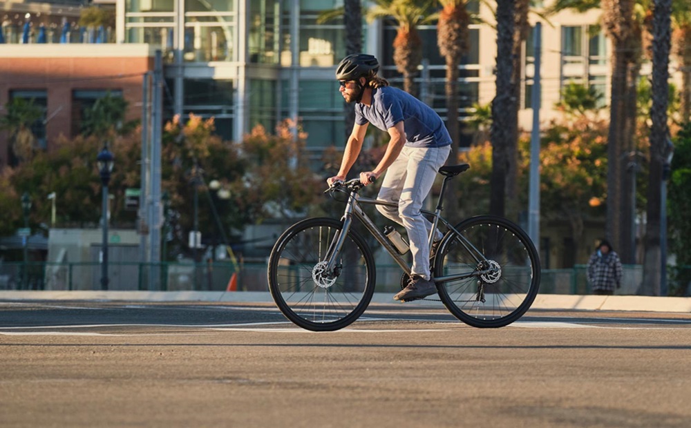 Young man cycling in the evening sun.